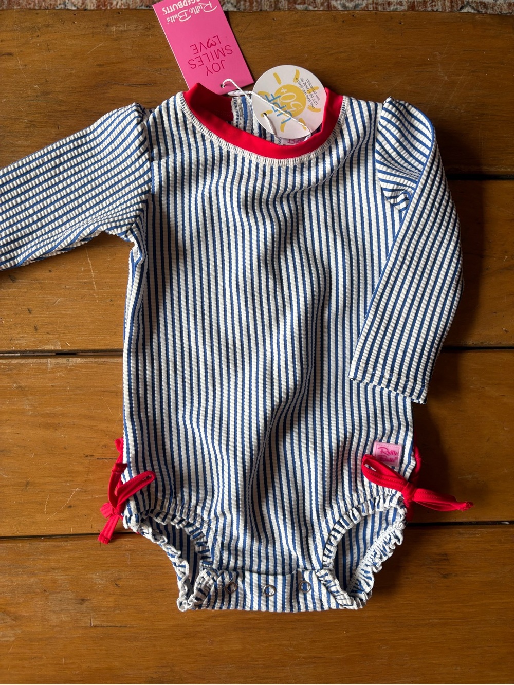 NWT Ruffle Butts Seersucker Navy/White Rashguard Suit with Red Accents - 12-18mo